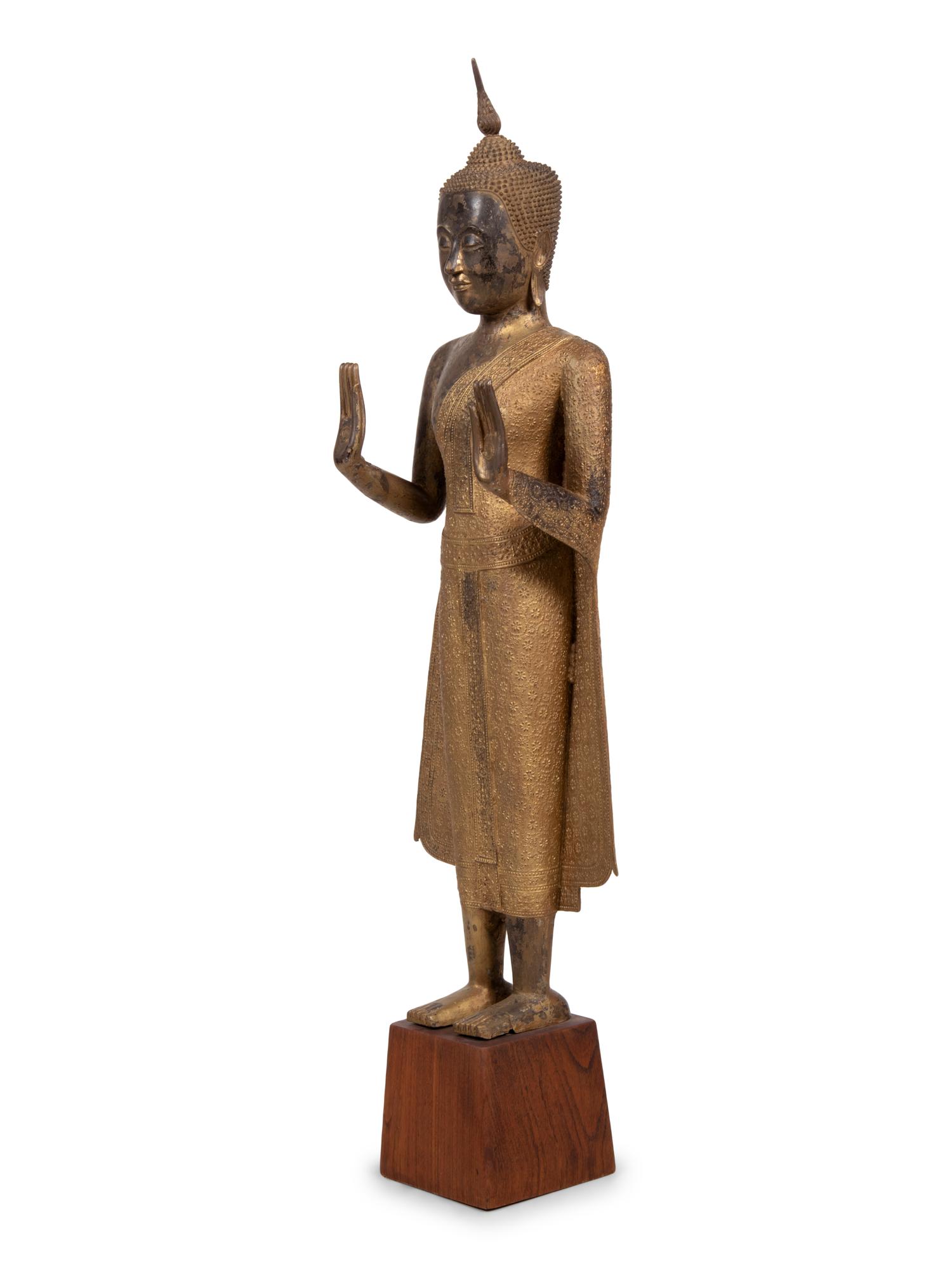 A Large Thai Gilt Decorated Bronze Figure of Standing Buddha