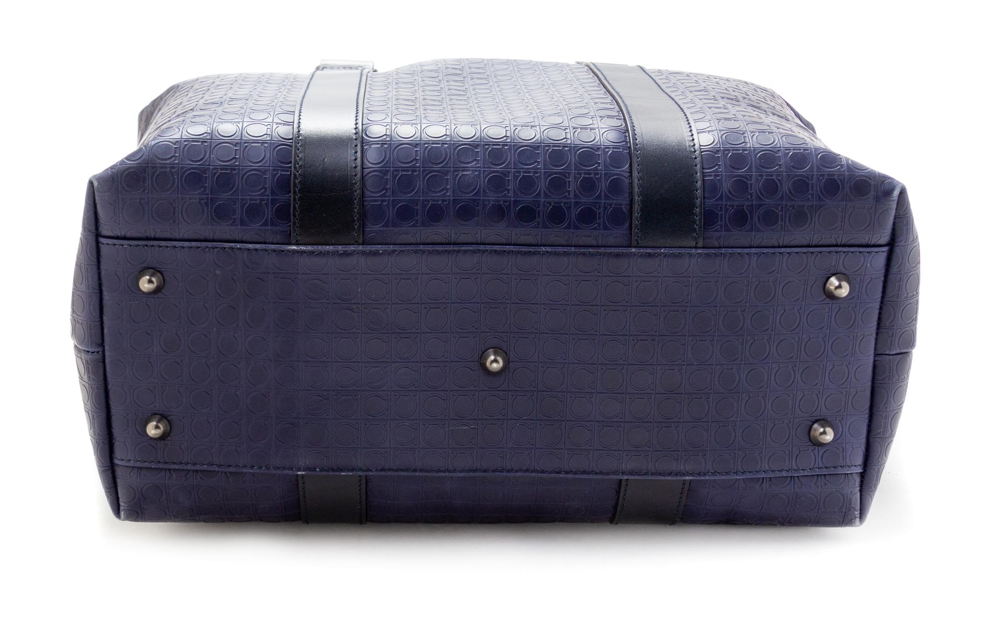 A Salvatore Ferragamo Navy Logo Embossed Leather Tote Bag, 11"H x 15"W x 7.25"D; Strap drop: 8".