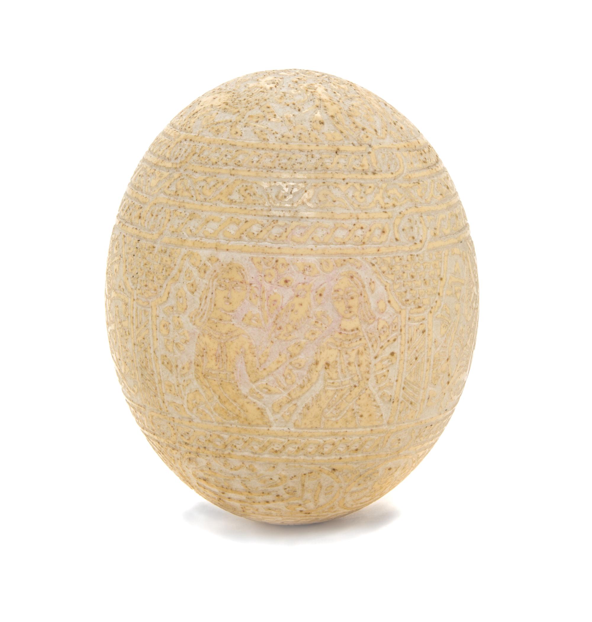 A Qajar Carved Ostrich Egg, Height 5 3/4 inches.
