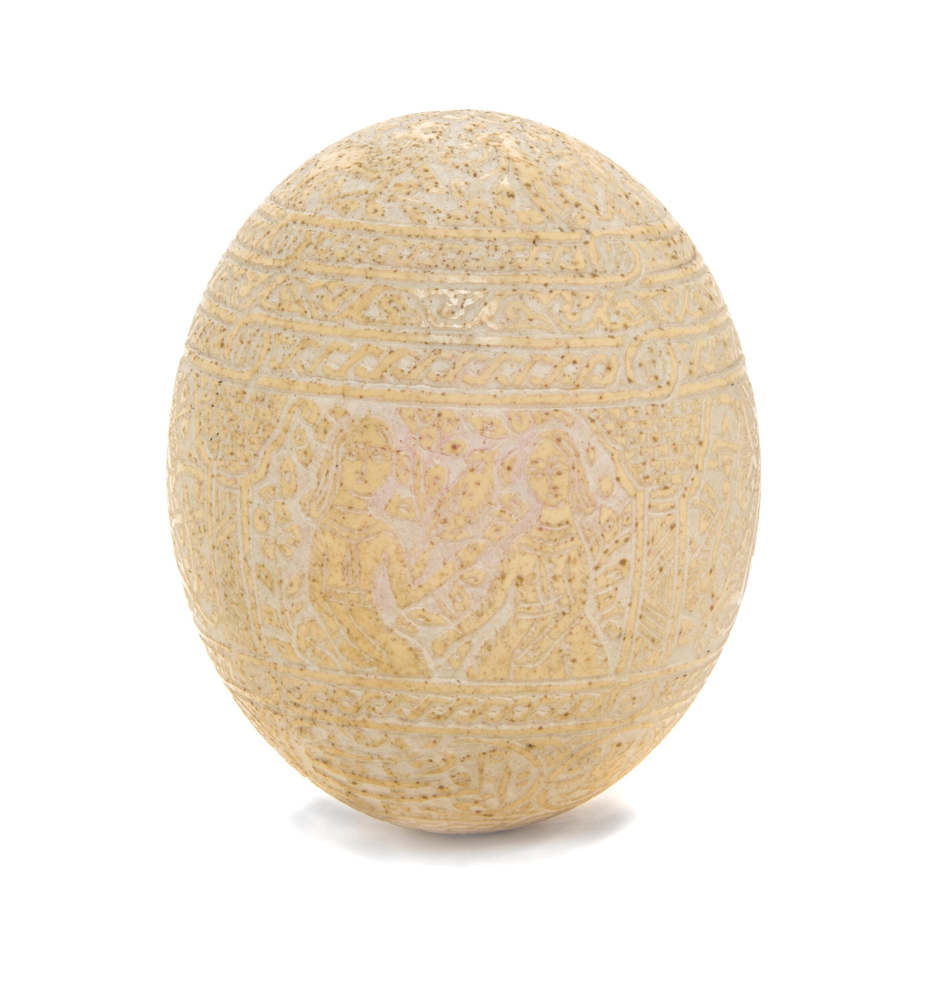 A Qajar Carved Ostrich Egg, Height 5 3/4 inches.