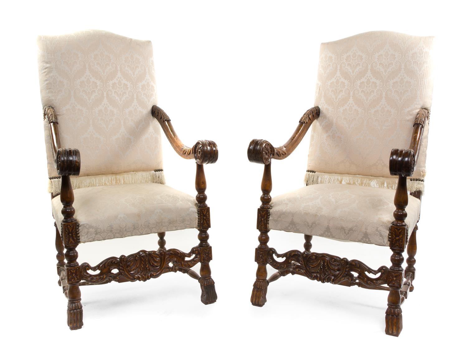 A Pair of Henry II Walnut Open Armchairs, Height 51 1/2 inches.