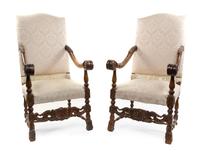 A Pair of Henry II Walnut Open Armchairs, Height 51 1/2 inches.