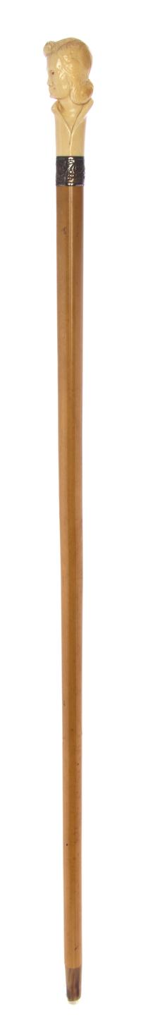 A Continental Ivory Handled Cane, Length of handle 3 3/4 x length overall 37 1/4 inches.