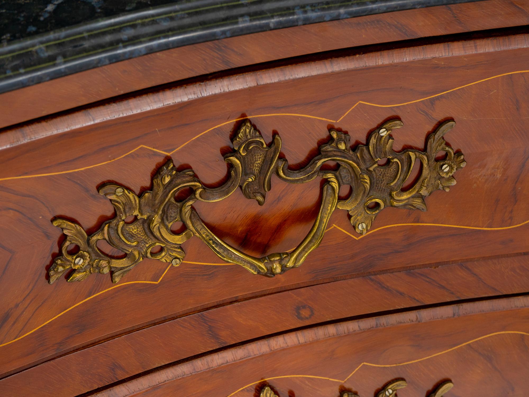 A Régence Style Gilt Metal Mounted Marble-Top Commode