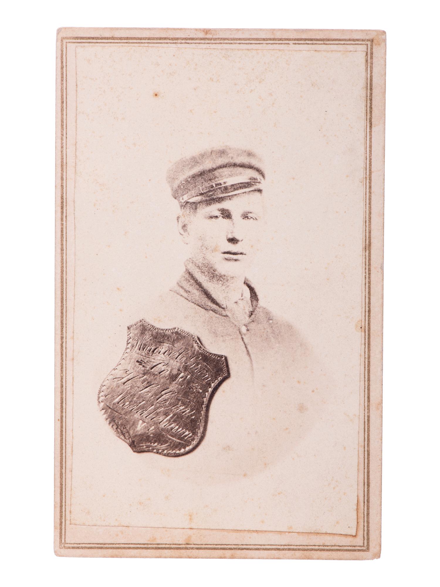 SHELL, J.H., photographer. CDV portrait of Private Horace C. Green, 2nd New York Cavalry, "Harris Light Cavalry," with superimposed ID shield. Findlay, OH: [ca 1860s].