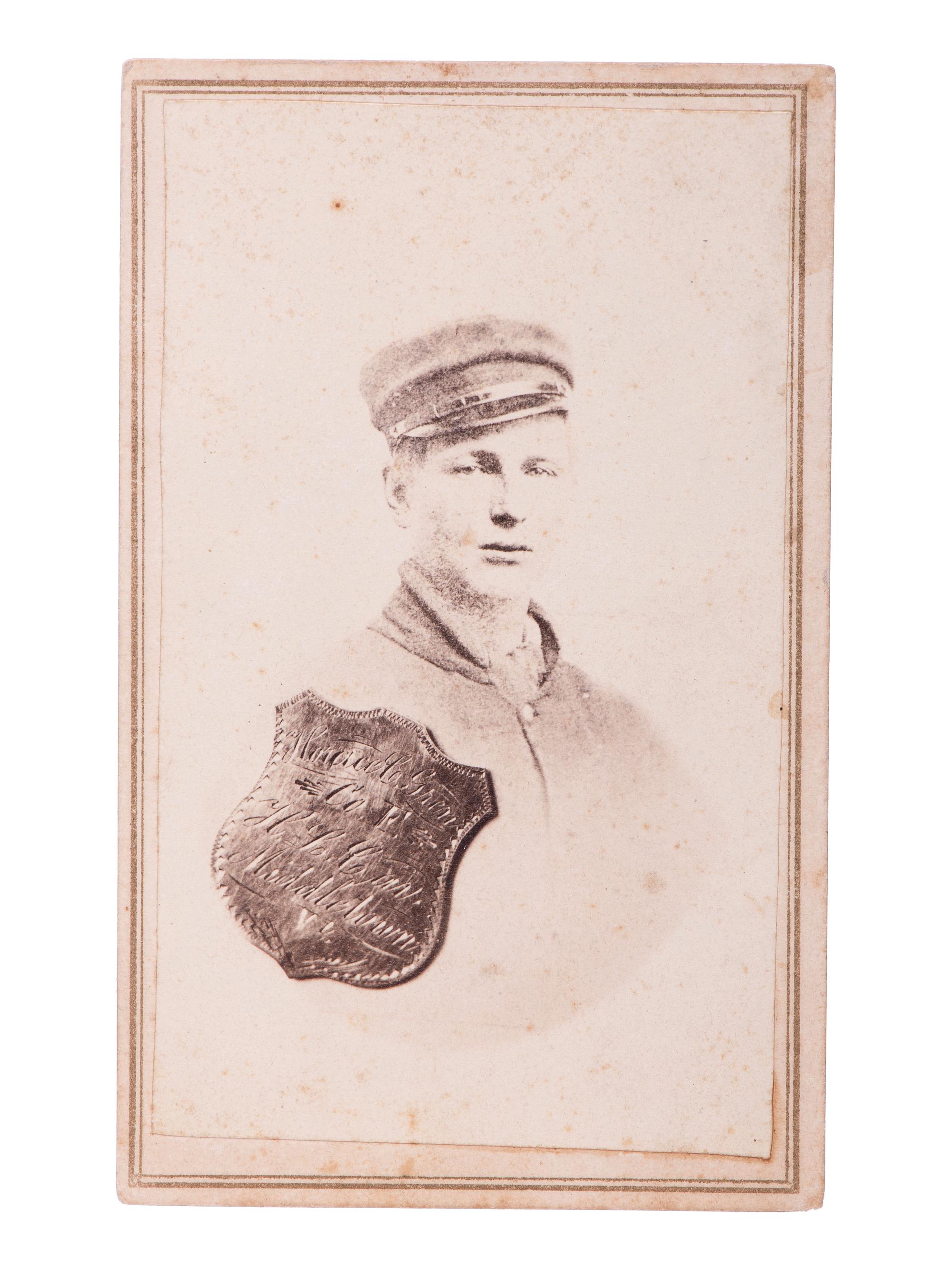 SHELL, J.H., photographer. CDV portrait of Private Horace C. Green, 2nd New York Cavalry, "Harris Light Cavalry," with superimposed ID shield. Findlay, OH: [ca 1860s].