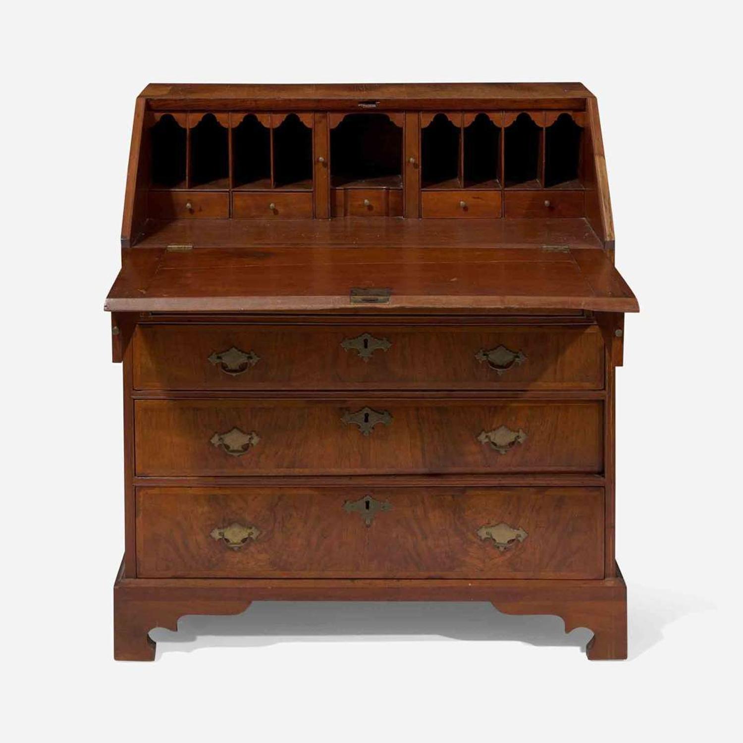A Queen Anne walnut-banded and pine slant-front desk circa 1740