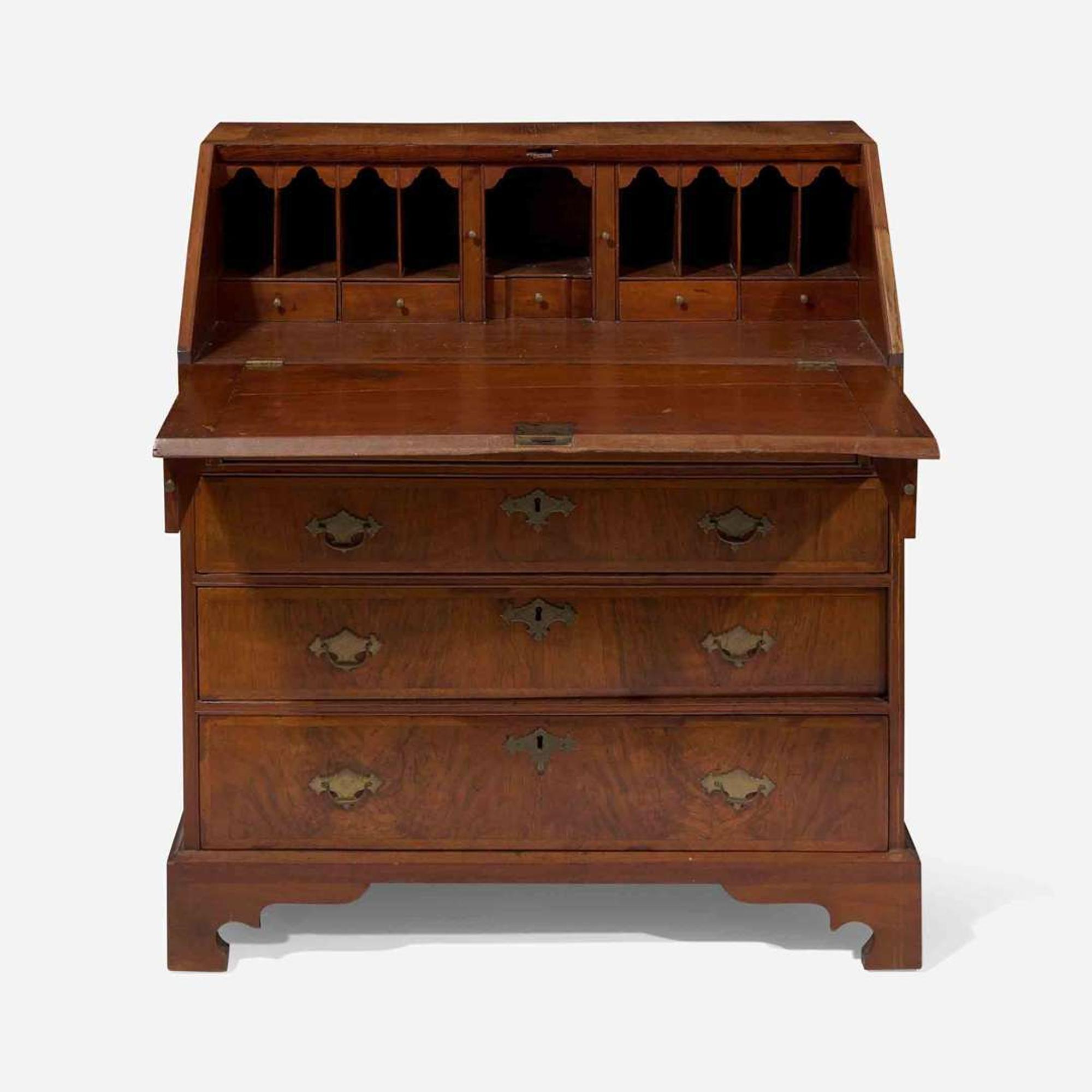 A Queen Anne walnut-banded and pine slant-front desk circa 1740