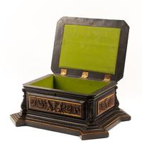 An Austrian Carved and Ebonized Wood Table Casket with a Lion
