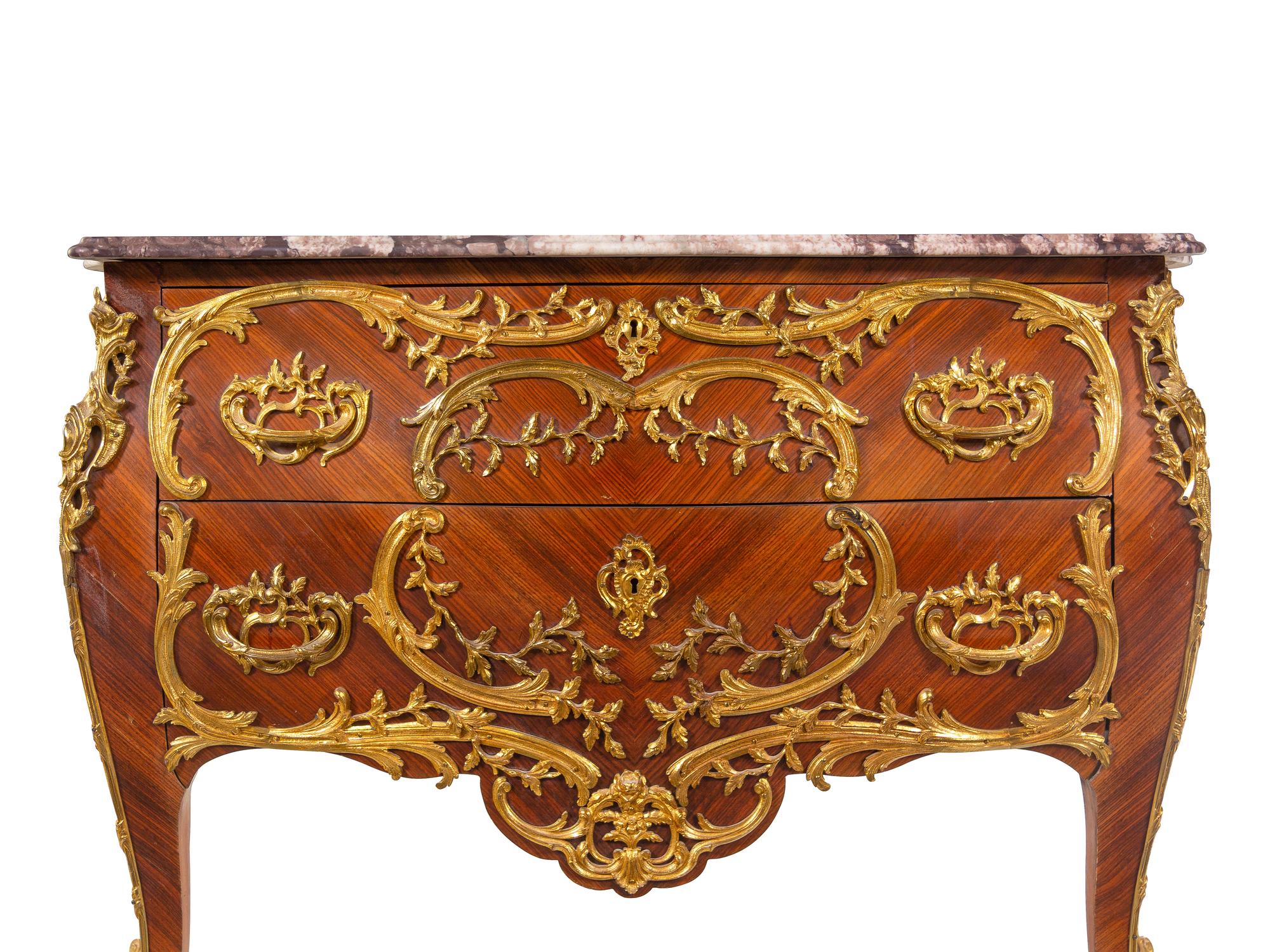A Louis XV Style Gilt Metal Mounted Kingwood Marble-Top Bombé Commode
