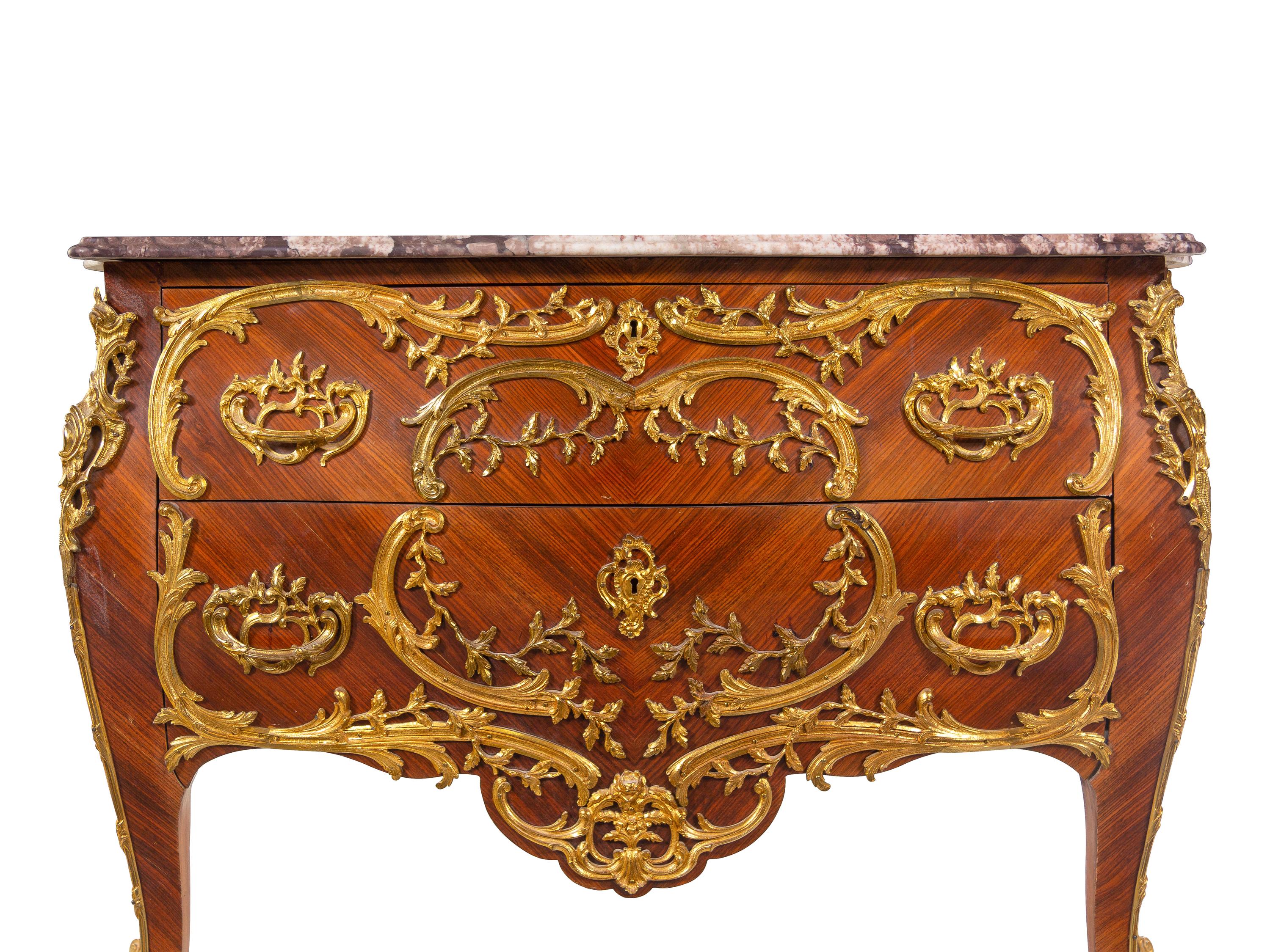 A Louis XV Style Gilt Metal Mounted Kingwood Marble-Top Bombé Commode