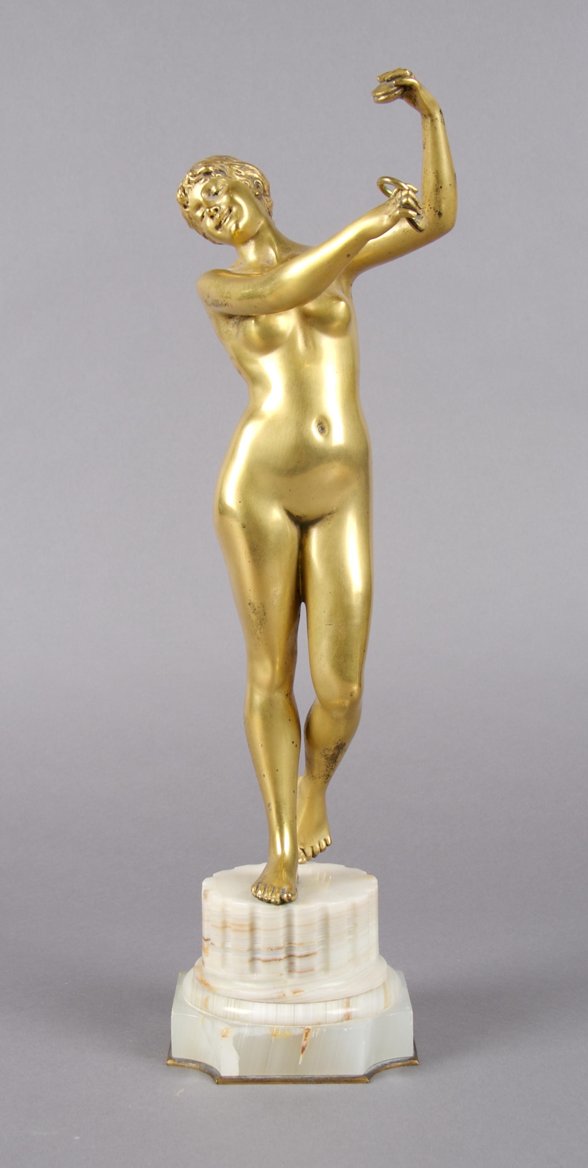 A Continental Gilt Bronze Figure, Height overall 14 3/4 inches.