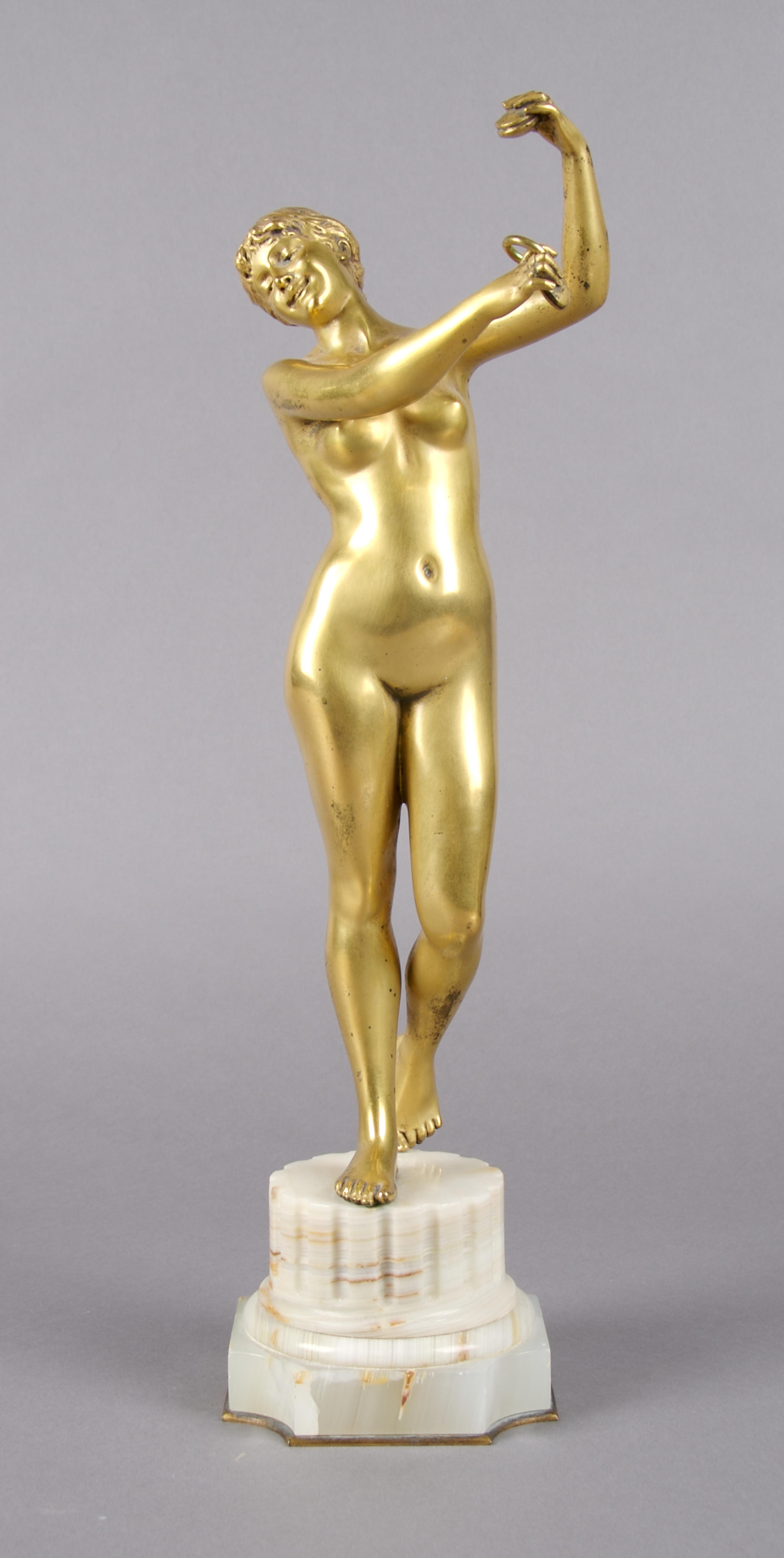 A Continental Gilt Bronze Figure, Height overall 14 3/4 inches.