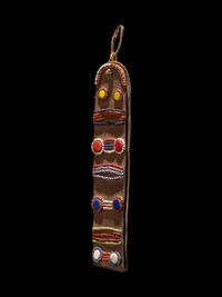 A Maasai Leather Hoop Decorated With Beads