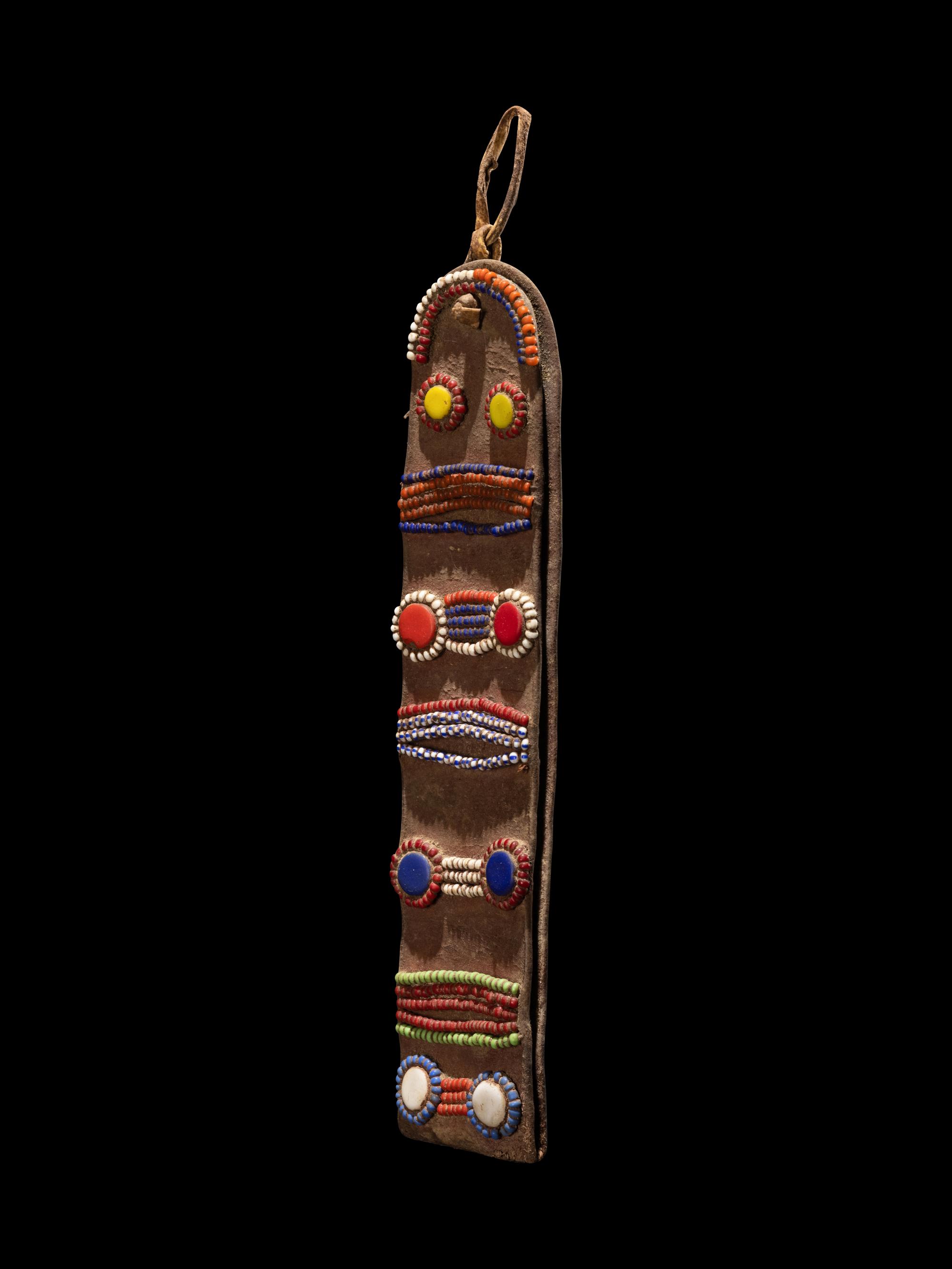 A Maasai Leather Hoop Decorated With Beads