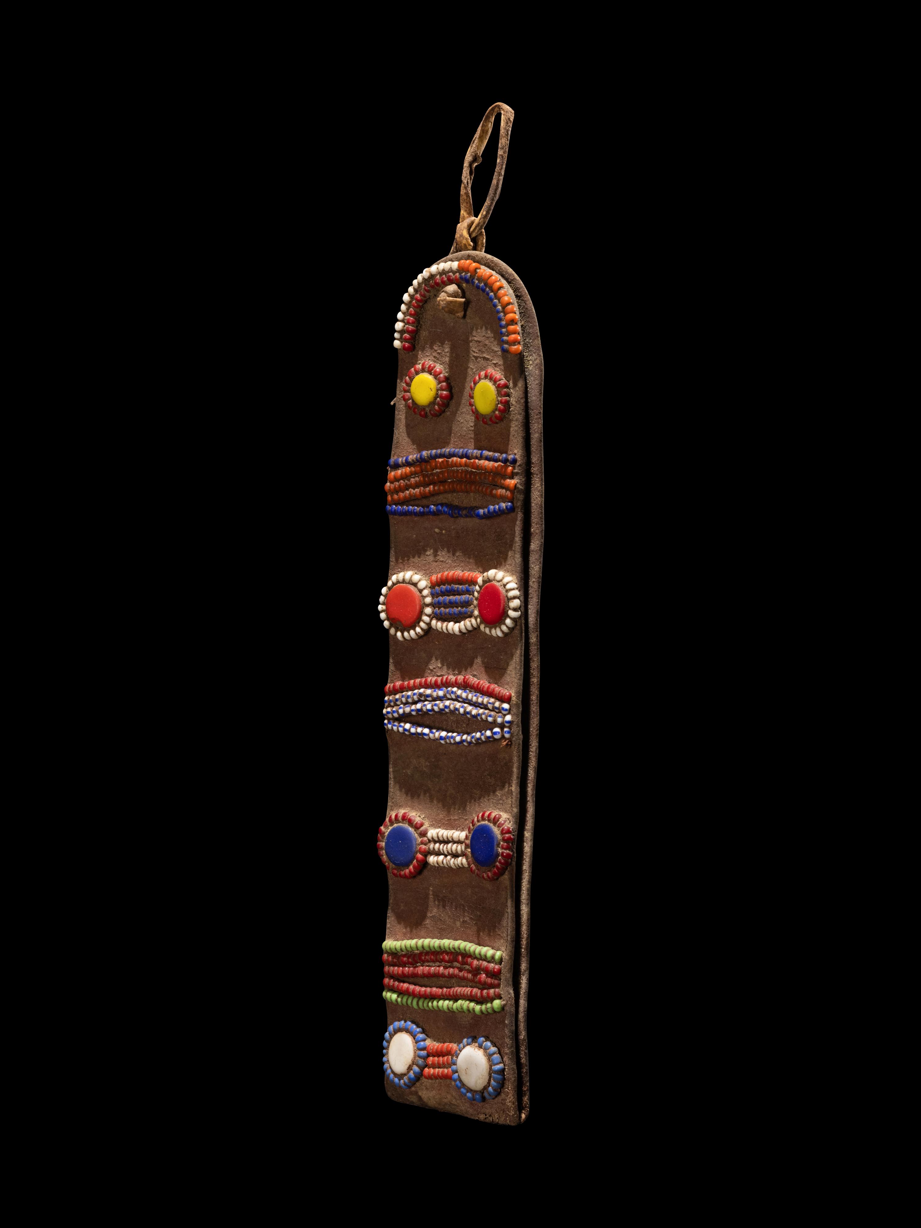 A Maasai Leather Hoop Decorated With Beads