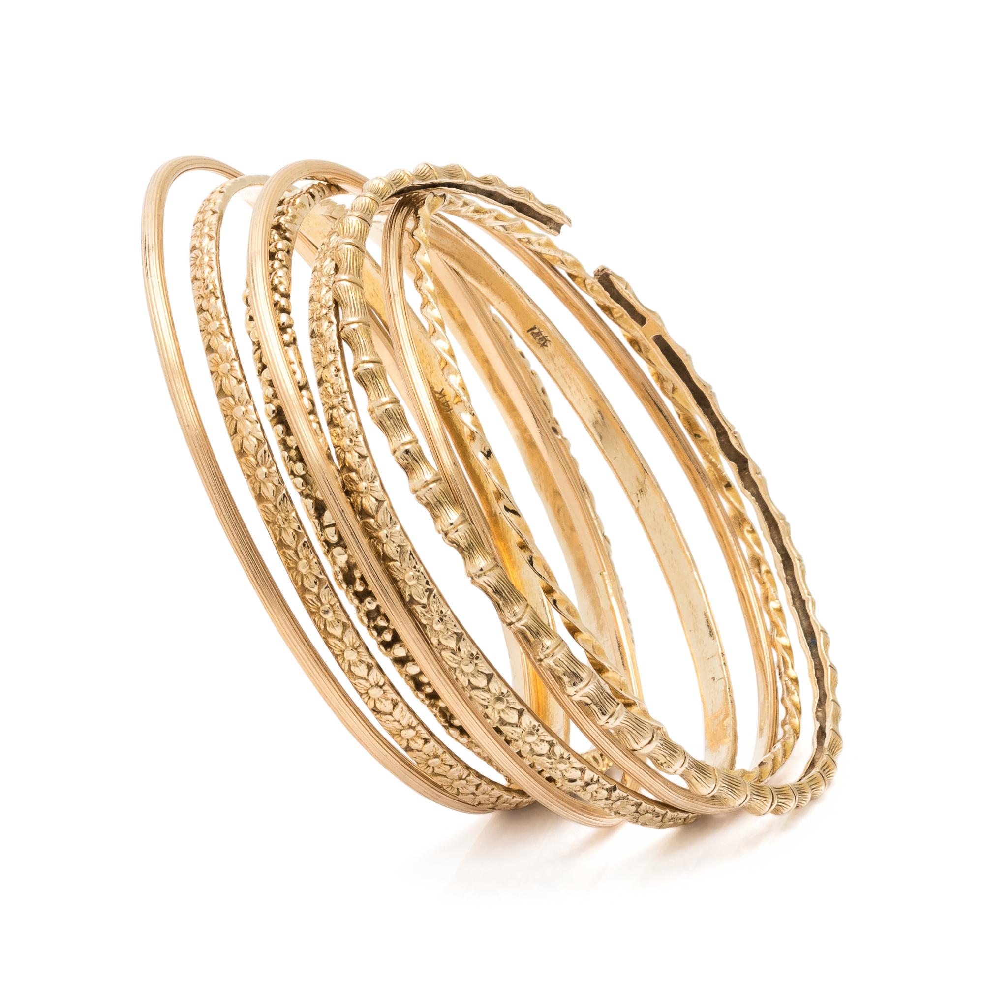 COLLECTION OF YELLOW GOLD BANGLE BRACELETS