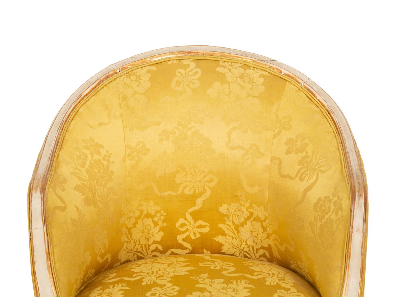 A Louis XV Style Painted and Parcel Gilt Barrel Back Bergere