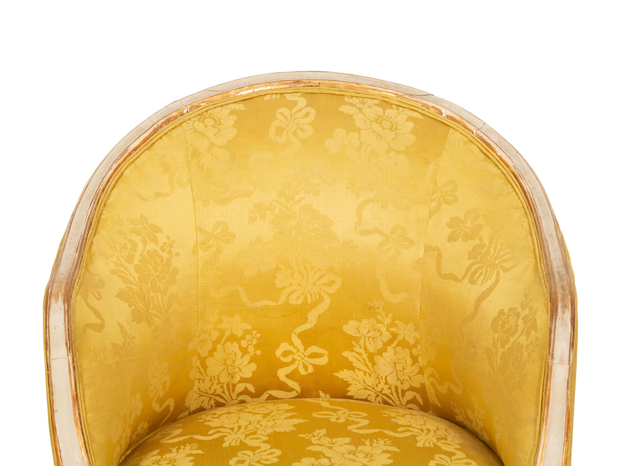 A Louis XV Style Painted and Parcel Gilt Barrel Back Bergere