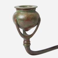 Tiffany Studios (American, active 1878-1932) A Bronze "Fleur de Lis" Two-Light Candelabra with Snuffer, USA, circa 1910