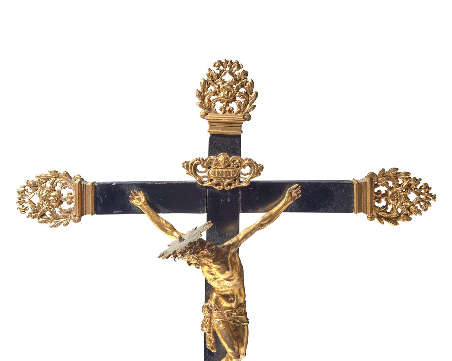 An Italian gilt bronze and ebonized wood crucifix, Naples, 17th century
