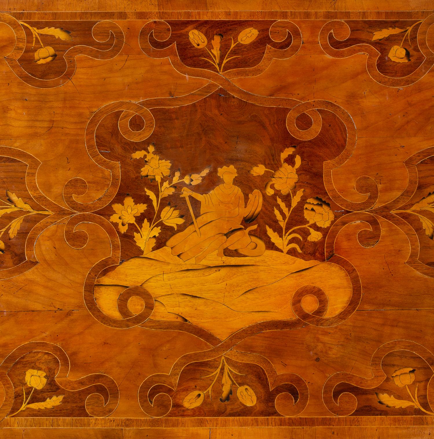 An Italian Carved and Satinwood Inlaid Walnut Center Table