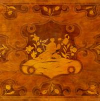 An Italian Carved and Satinwood Inlaid Walnut Center Table