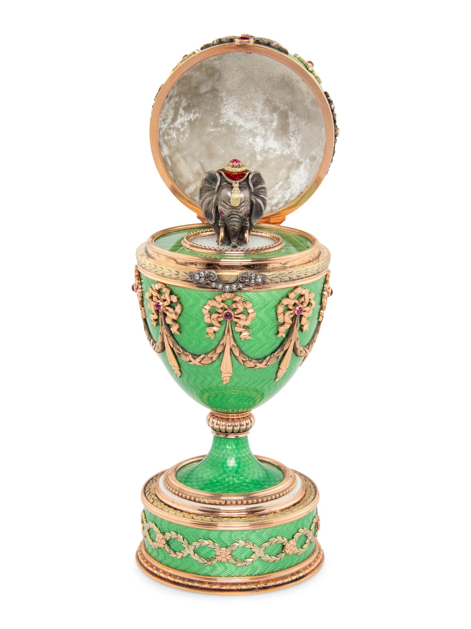 A Gold, Guilloché Enamel and Gemstone-Mounted Surprise Egg