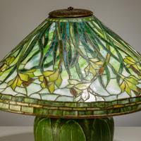 Tiffany Studios New York (American, 1892–1930) — Swirling Daffodil Table Lamp with Grueby Pottery Base
