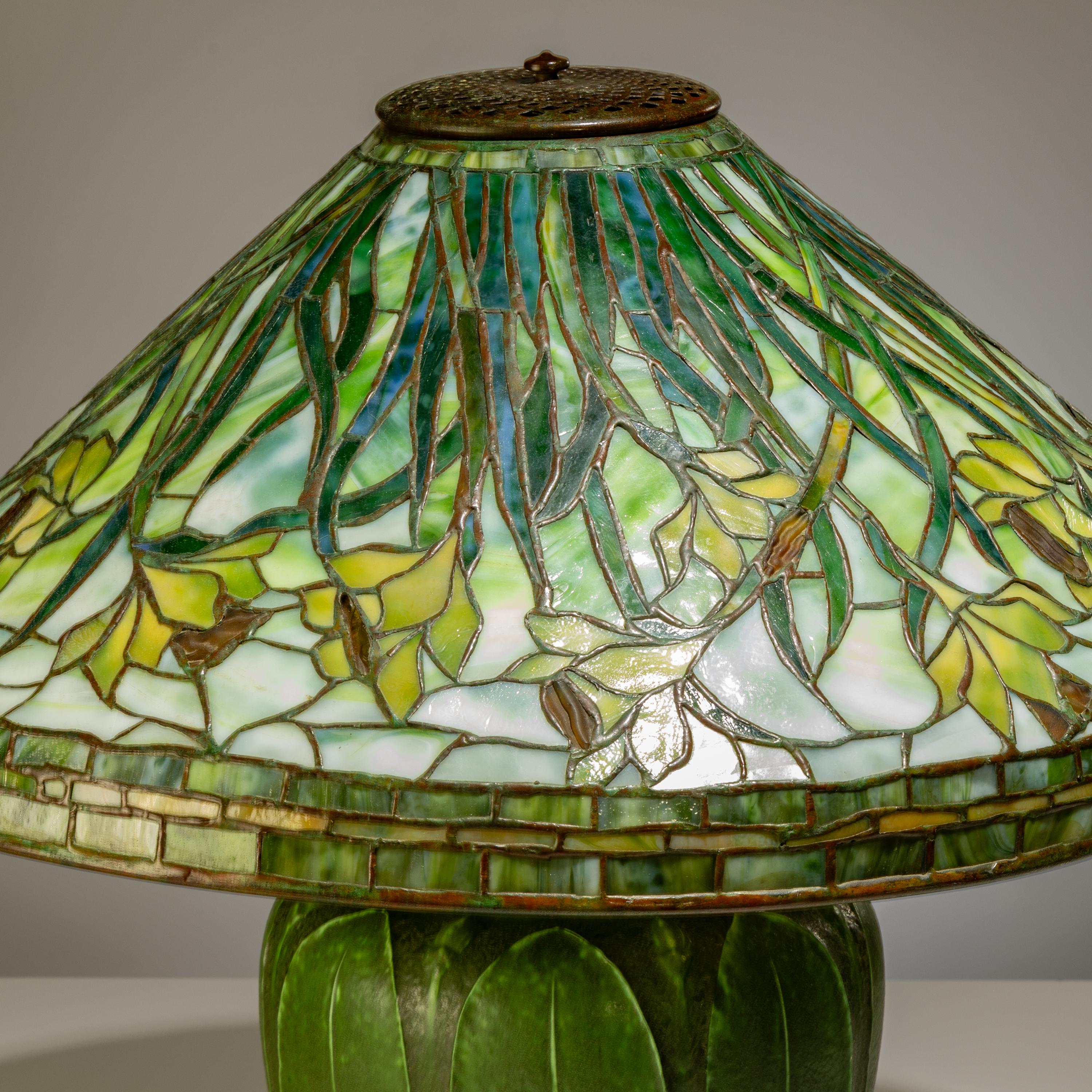 Tiffany Studios New York (American, 1892–1930) — Swirling Daffodil Table Lamp with Grueby Pottery Base