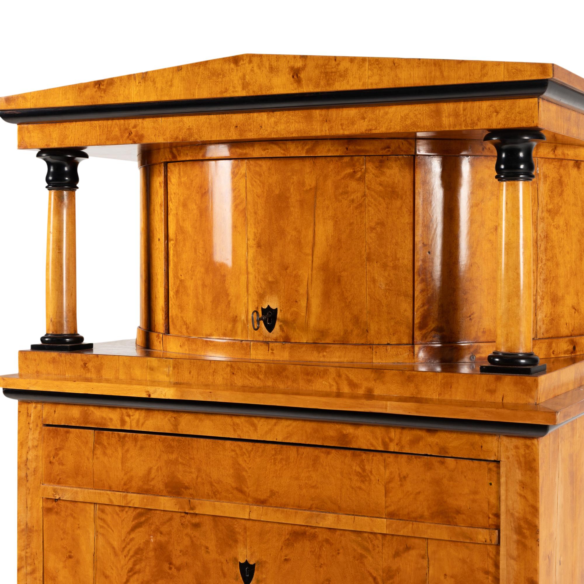 A Biedermeier Part-Ebonized Fruitwood Cabinet