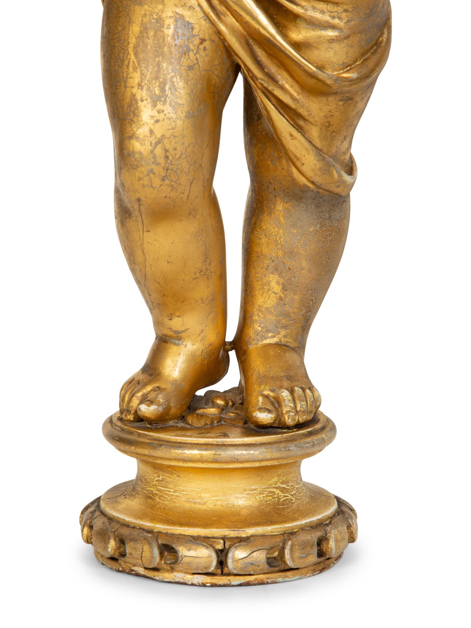 A Pair of Continental Giltwood Figures of Putti