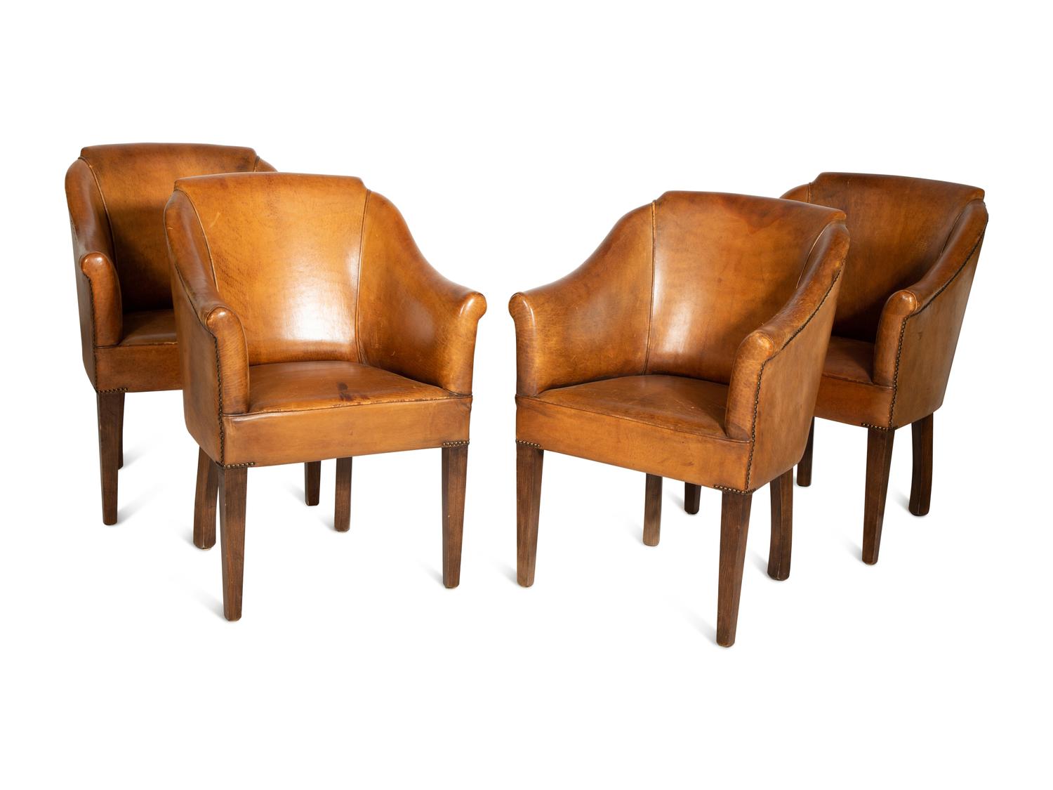 A Set of Four Leather-Upholstered Barrel-Back Armchairs