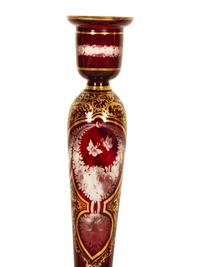 A Set of Four Bohemian Ruby Cut-to-Clear Glass Candlesticks with Gilt Decoration. — 19th Century