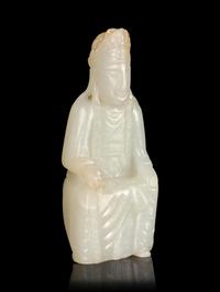 A Carved White Jade Figure of Guanyin