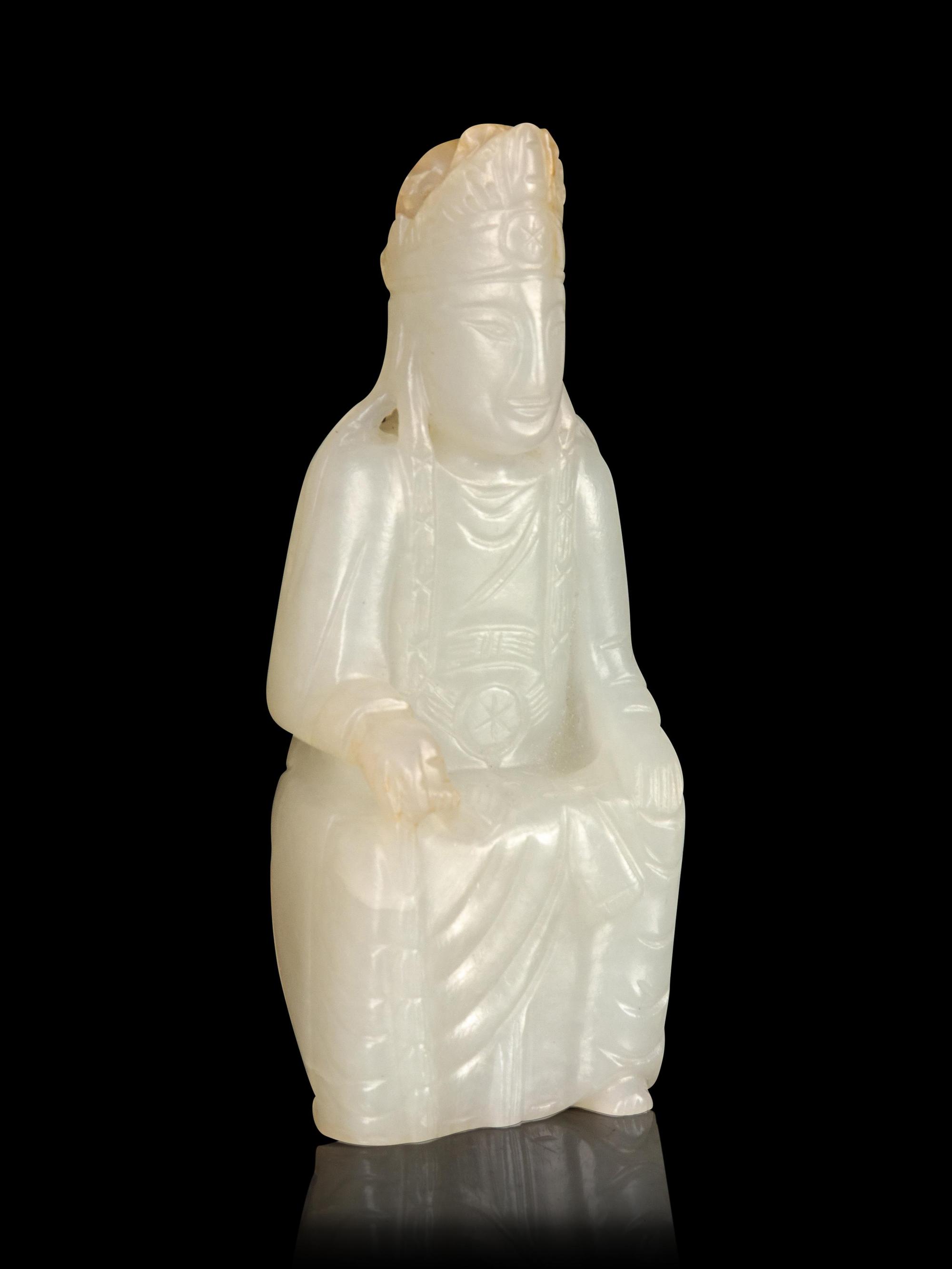 A Carved White Jade Figure of Guanyin