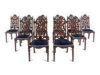 A Set of Ten Jacobean Style Carved Walnut Dining Chairs