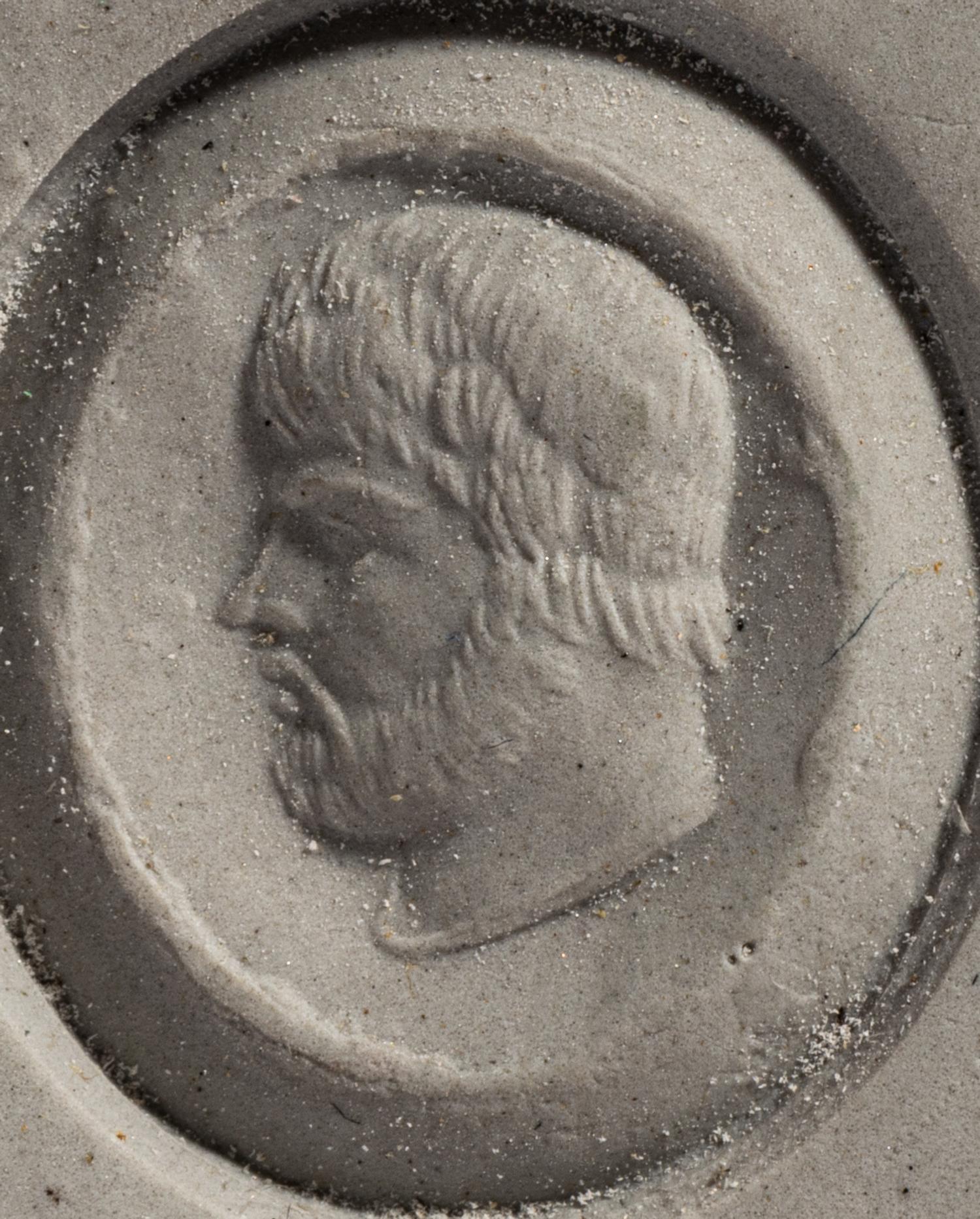 A Roman Amethyst Ring Stone with a Male Portrait Head — Set in a gold ring