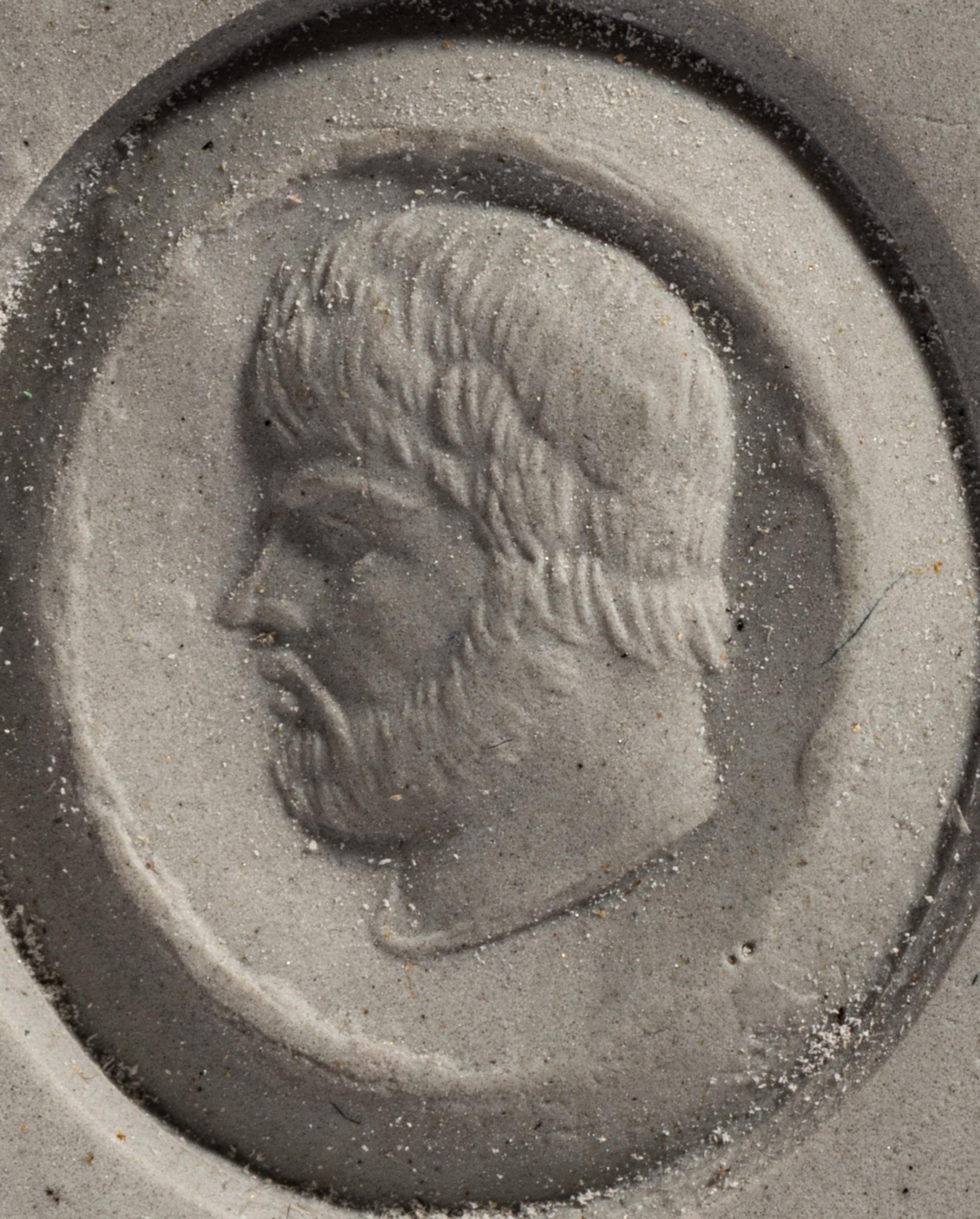 A Roman Amethyst Ring Stone with a Male Portrait Head — Set in a gold ring