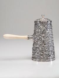 An American Silver Repoussé Chocolate Pot