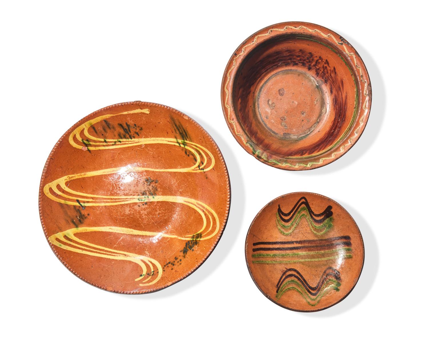 A Green and Brown Slip-Decorated Redware Pie Plate, Dryville, Pennsylvania, 19th Century