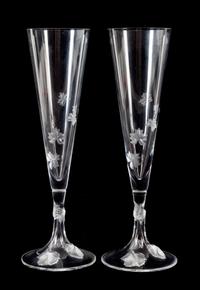 A Set of Twelve Lalique Molded and Frosted Glass Champagne Flutes Height 10 inches. — 20TH CENTURY