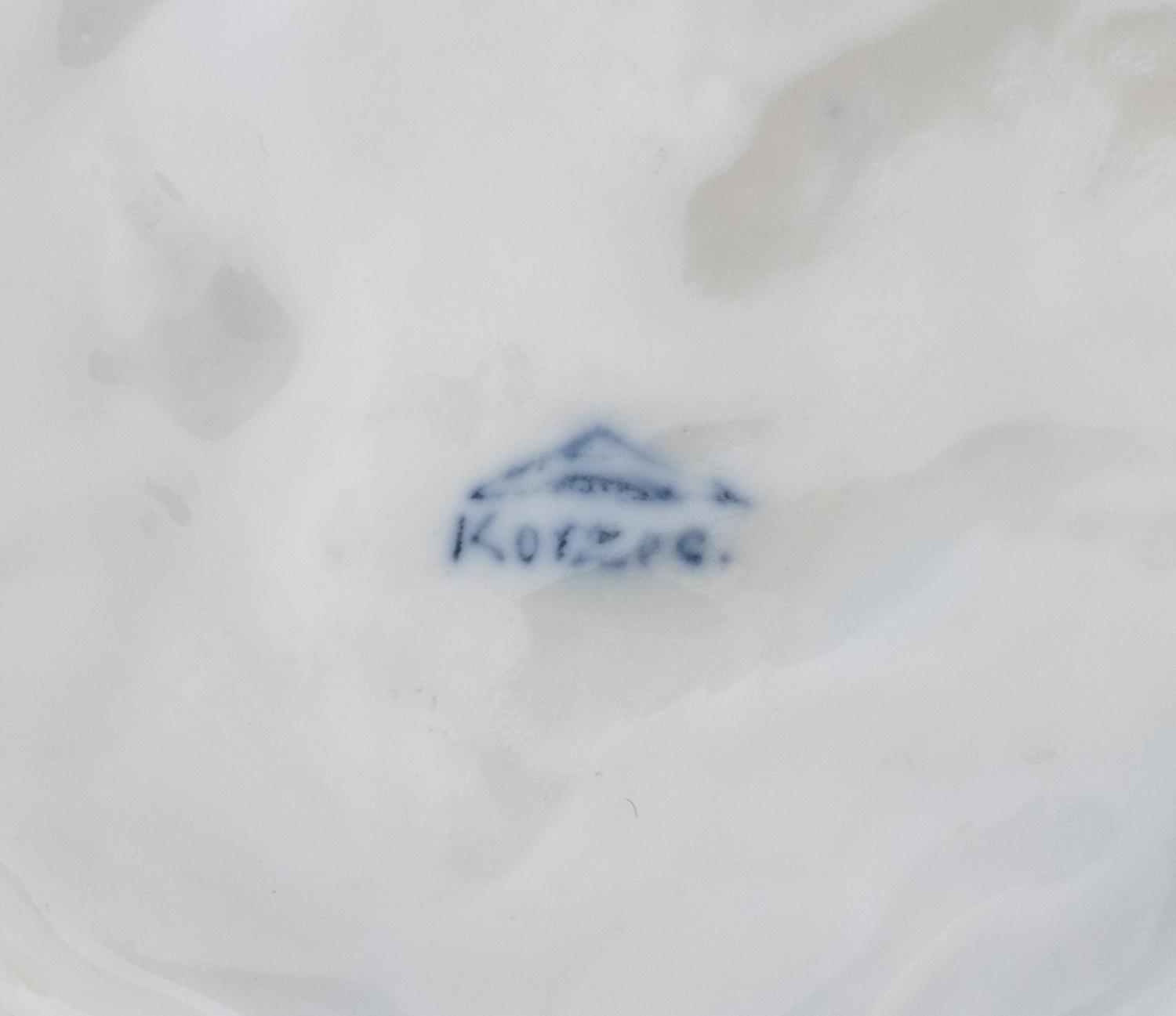 A Korzec Porcelain Dog Figure