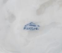 A Korzec Porcelain Dog Figure