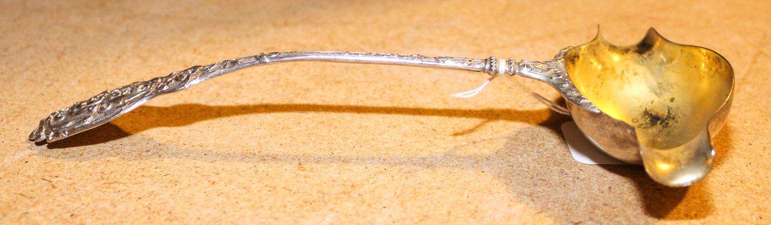 A German Silver Punch Ladle, Hanau makers mark, 19th century, the handle decorated with a portrait of a young man, the ladle having spo