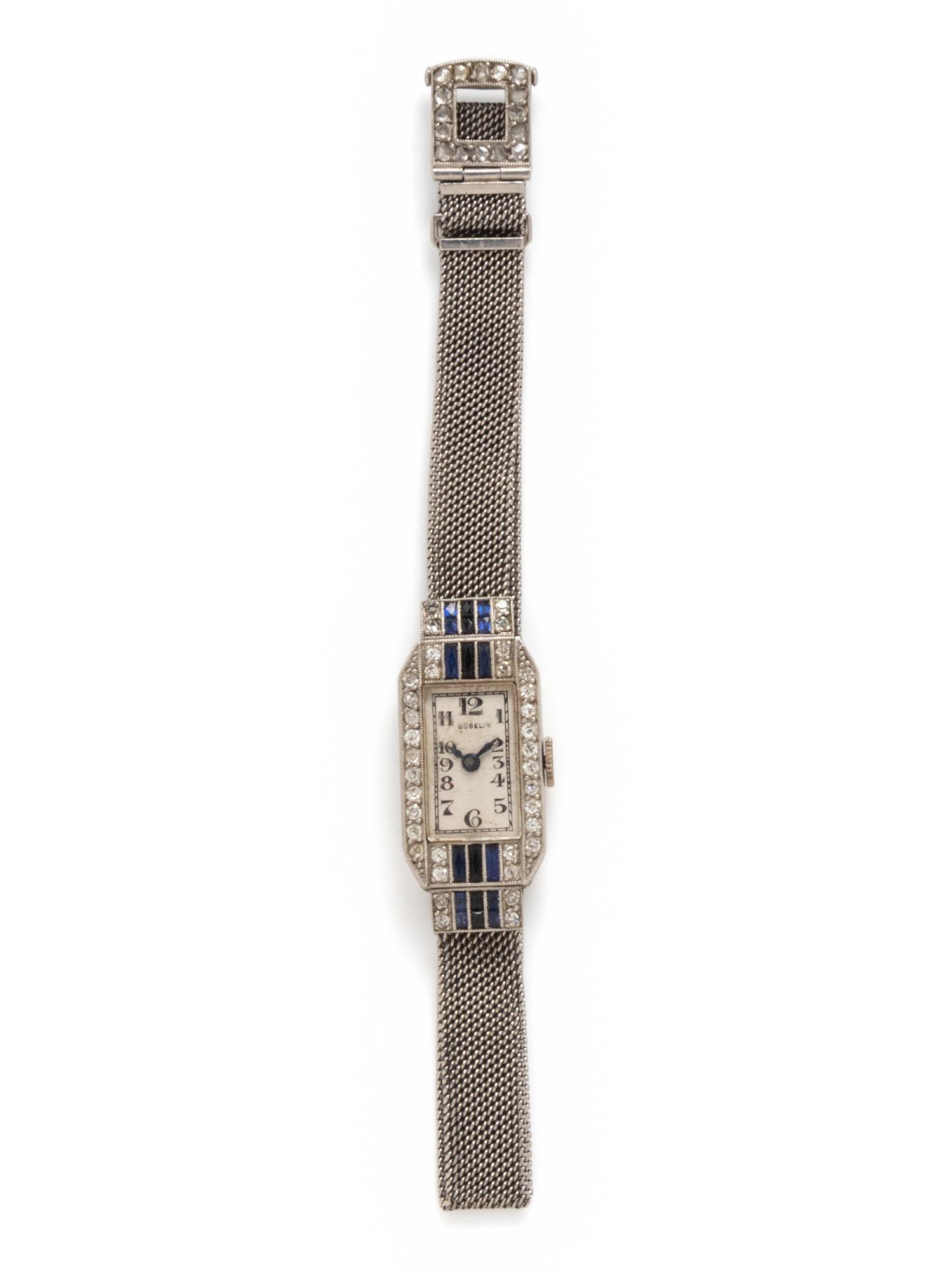 GÜBELIN, PLATINUM, DIAMOND, SYNTHETIC SAPPHIRE AND BLACK ONYX WATCH