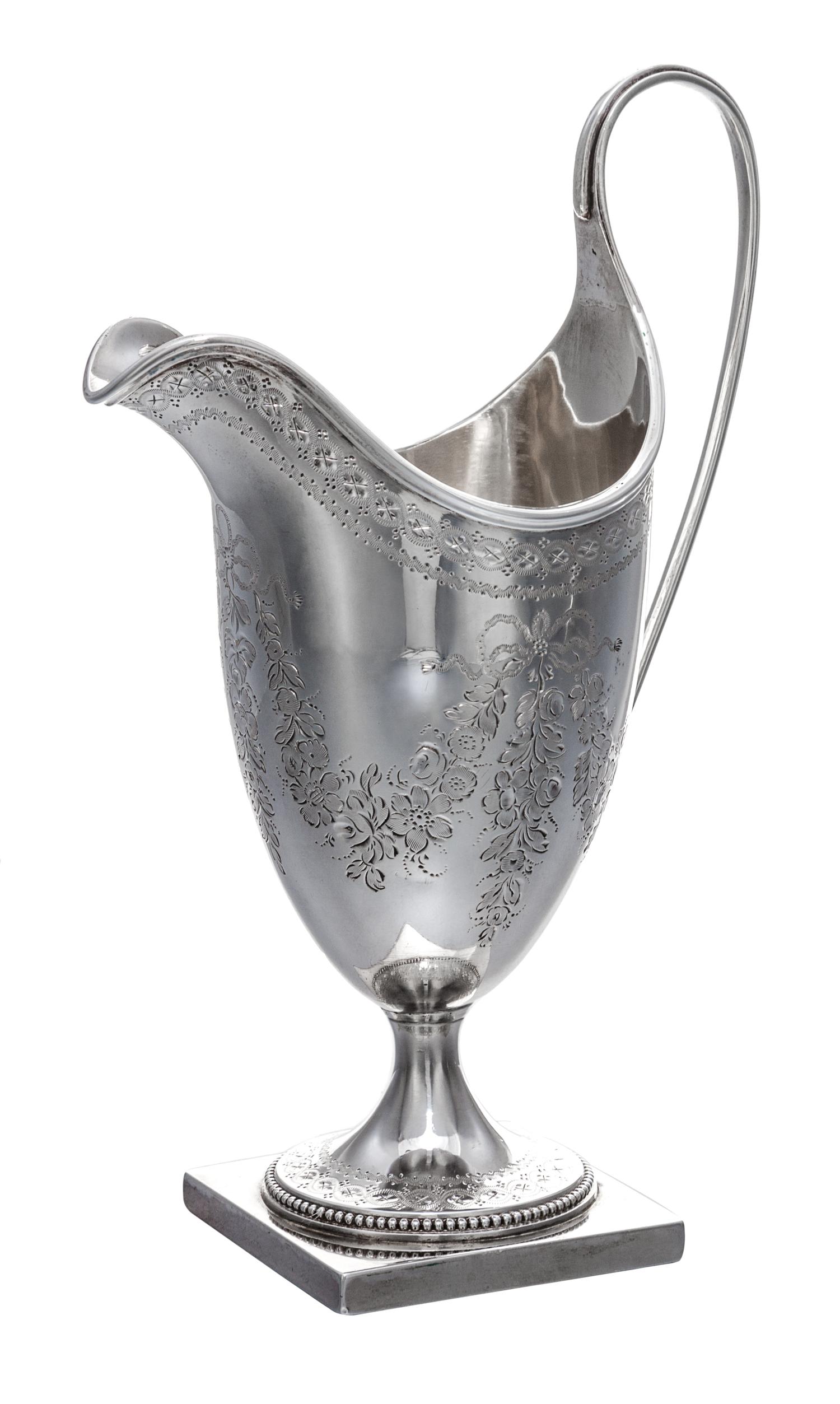 A George III Silver Creamer, Hester Bateman, London, 1782, of slender cylindrical form, worked to show floral swags and ribbons.