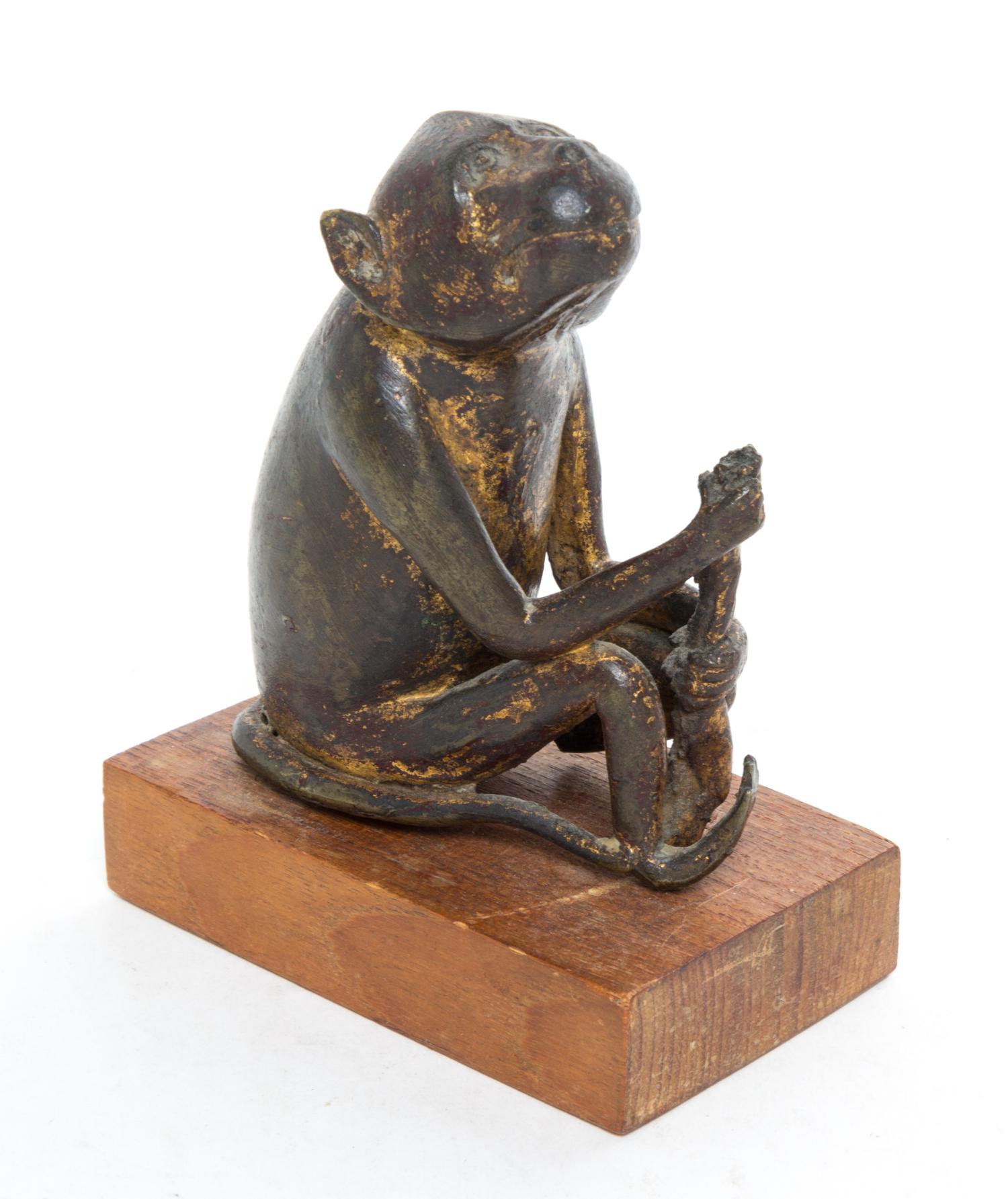 A Japanese Bronze Figure of a Monkey Height overall 5 1/2 inches.