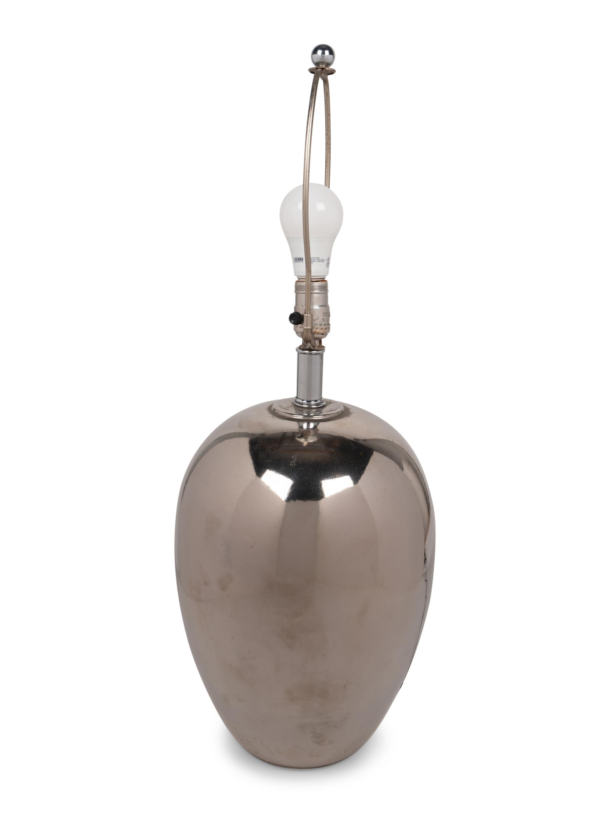 A Silvered Table Lamp with a Quail Feather Shade