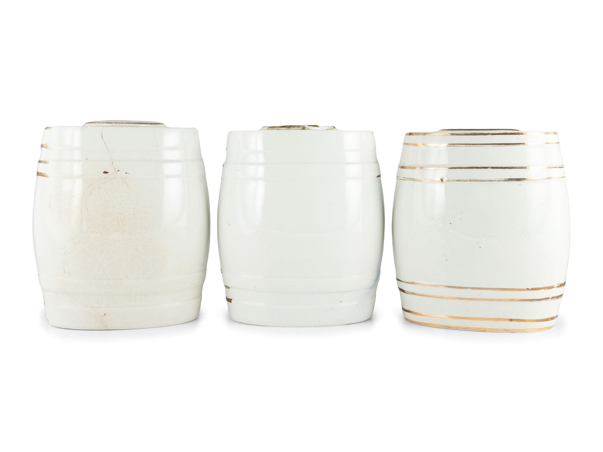 Three English Parcel-Gilt Porcelain Counter Top Liquor Dispensers